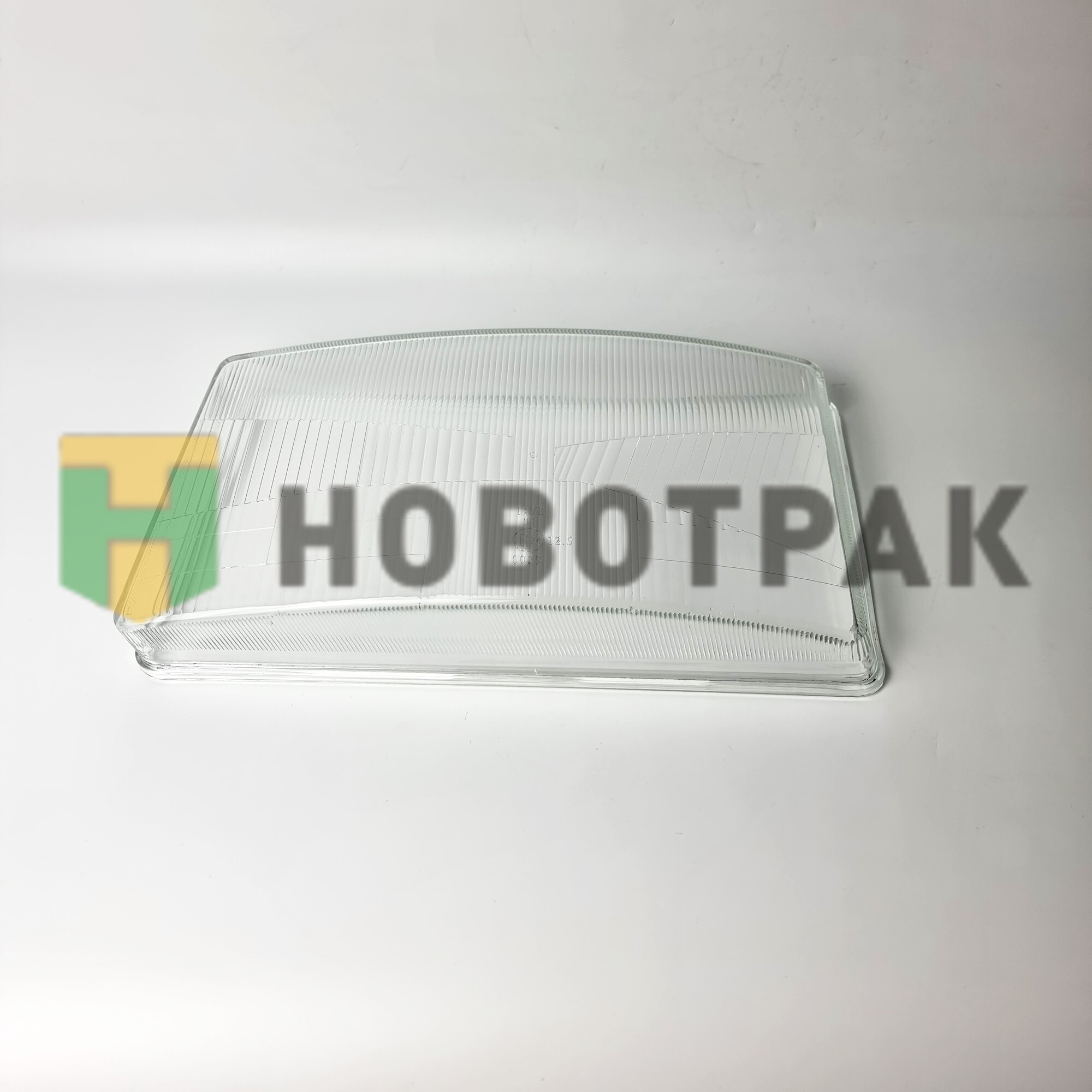 Стекло фары левое Scania TD0152001BLS