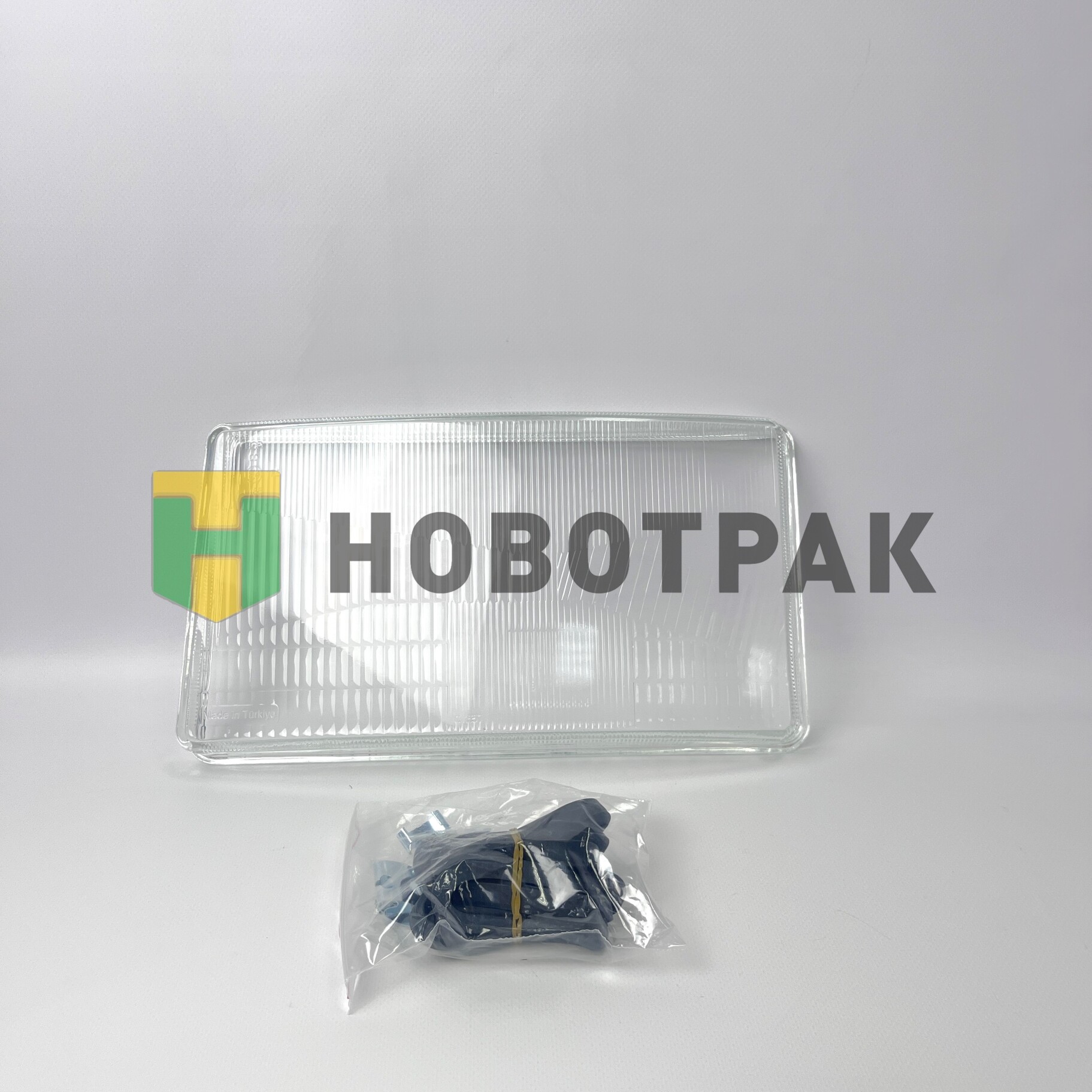 Стекло фары левое Scania 73518